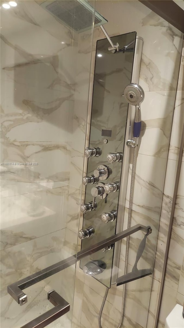 full bathroom featuring a shower stall