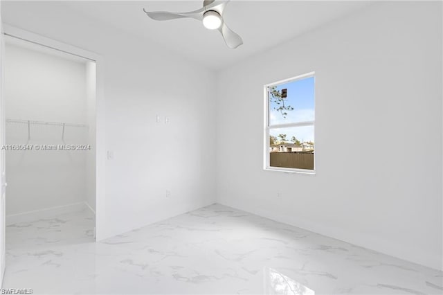 empty room featuring ceiling fan