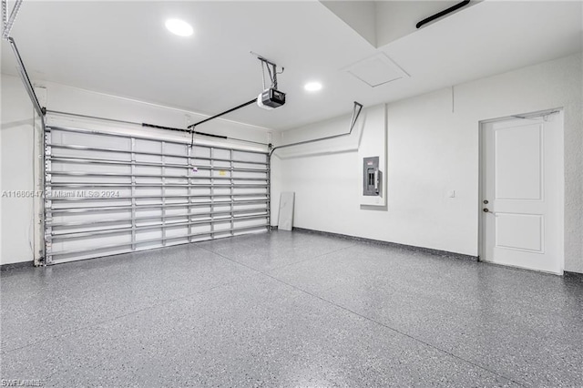 garage with electric panel and a garage door opener