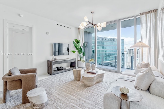 living room featuring floor to ceiling windows and an inviting chandelier