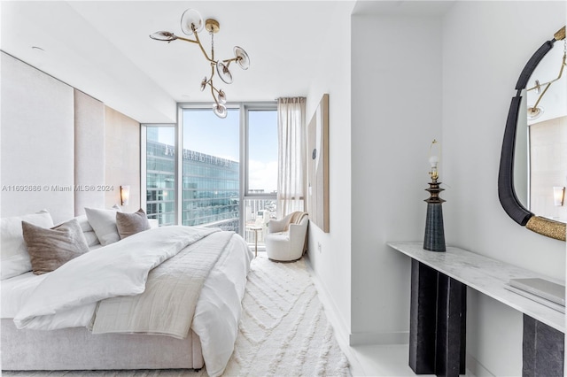 bedroom featuring a wall of windows