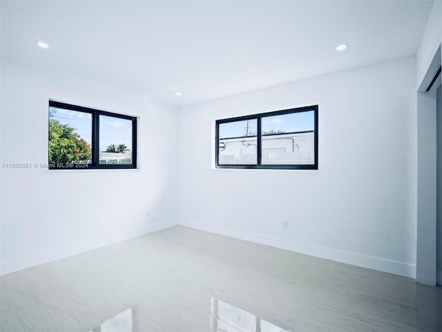 spare room featuring a wealth of natural light