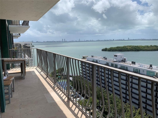 balcony featuring a water view