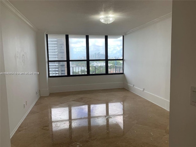 unfurnished room featuring crown molding