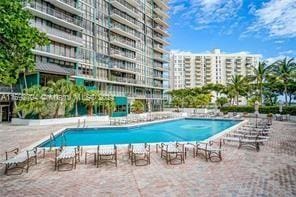 view of swimming pool featuring a patio