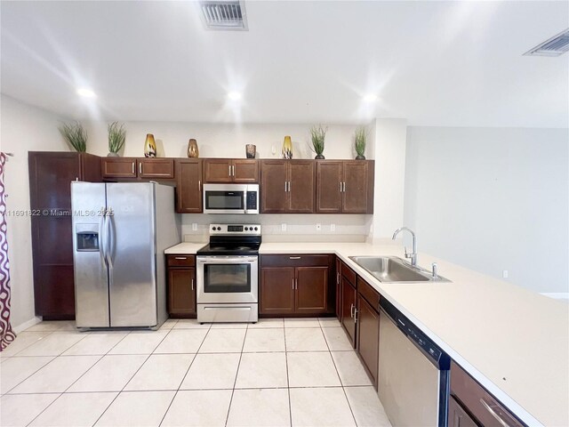 tiled dining area featuring a textured ceiling