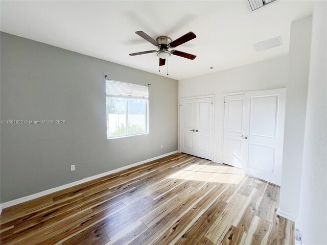 full bathroom featuring shower / bath combo, tile patterned flooring, vanity, and toilet