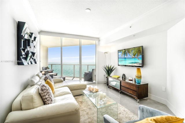 living room featuring expansive windows and a textured ceiling