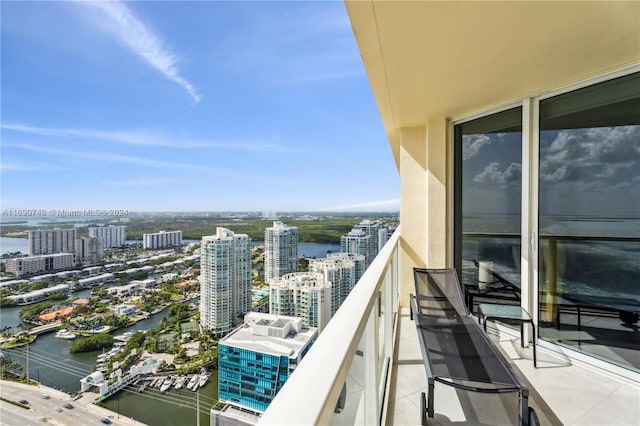 balcony featuring a water view