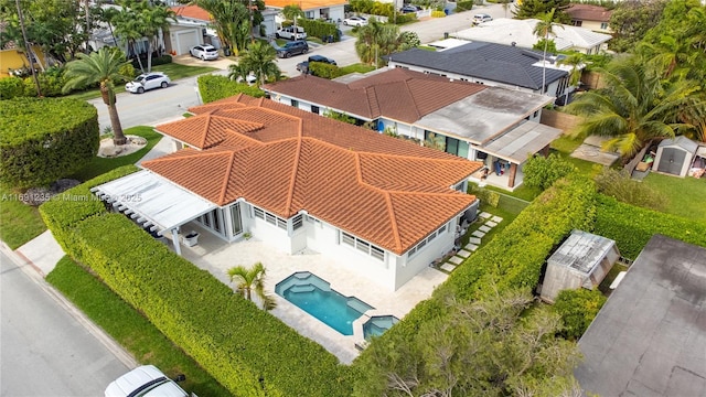 birds eye view of property with a residential view