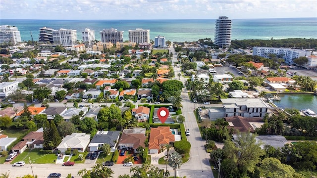 drone / aerial view featuring a water view and a residential view