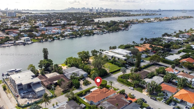 aerial view with a water view, a city view, and a residential view