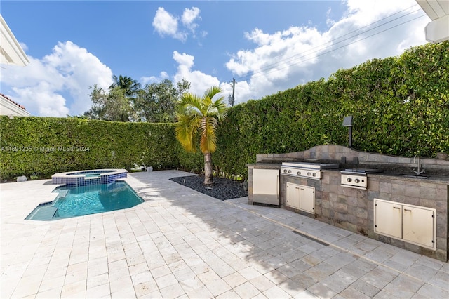 view of pool with an in ground hot tub, area for grilling, sink, grilling area, and a patio area