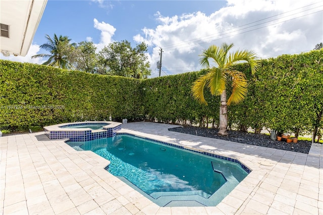 view of pool with central air condition unit, a patio, and a pool with connected hot tub