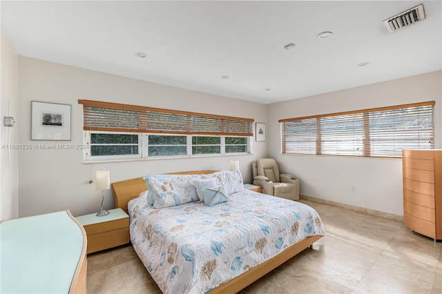 bedroom featuring multiple windows