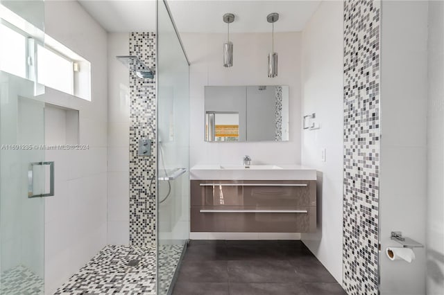 bathroom featuring vanity and a shower with shower door