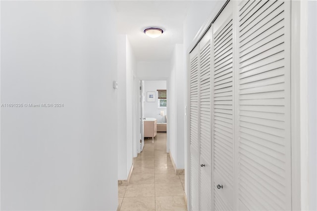 hallway with light tile patterned floors