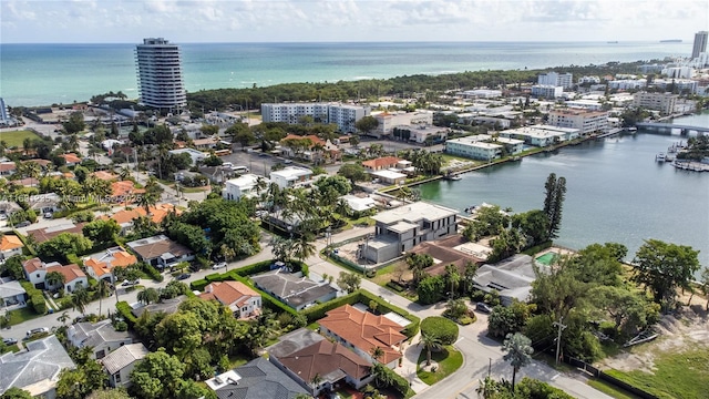 bird's eye view featuring a view of city and a water view