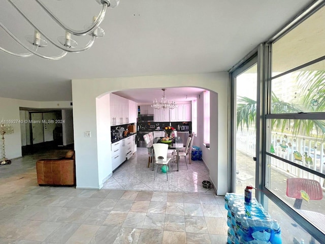 dining space featuring an inviting chandelier