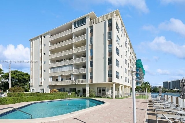 9111 E Bay Harbor Dr Unit 3E, Bay Harbor Islands, FL 33154 - view of apartment building / complex featuring a community pool