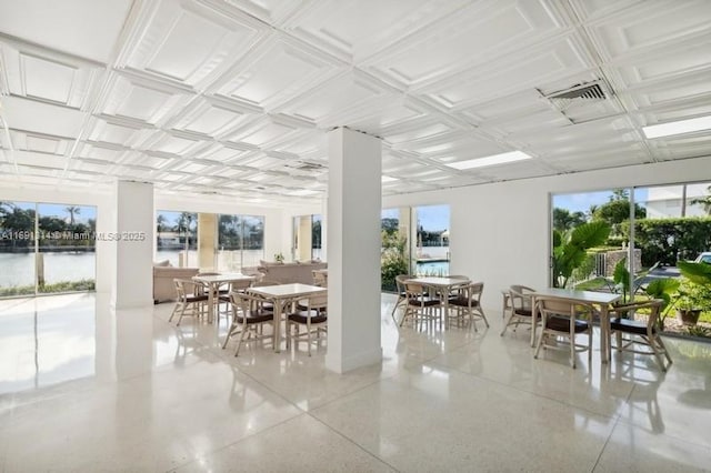 9111 E Bay Harbor Dr Unit 3E, Bay Harbor Islands, FL 33154 - dining area featuring plenty of natural light, speckle patterned floor, and a water view