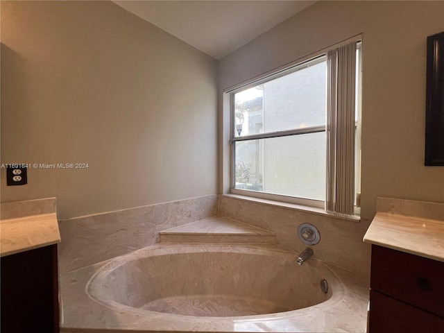 bathroom featuring a bathing tub and vanity