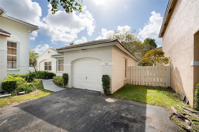 view of side of home featuring a garage