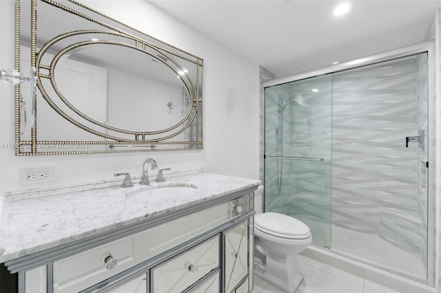 bathroom with tile patterned flooring, an enclosed shower, vanity, and toilet