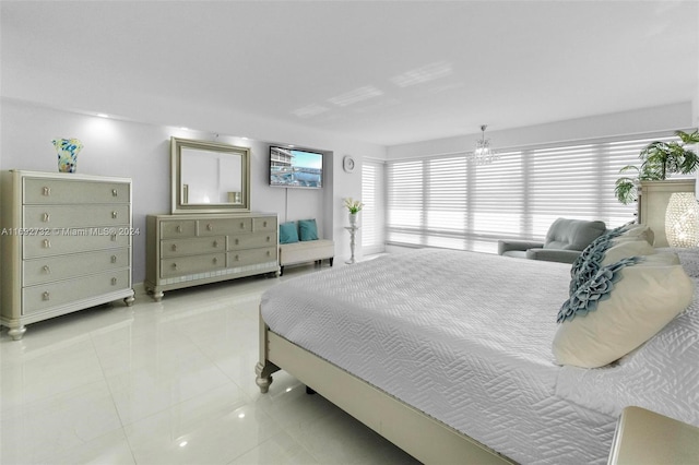 bedroom with multiple windows and light tile patterned floors