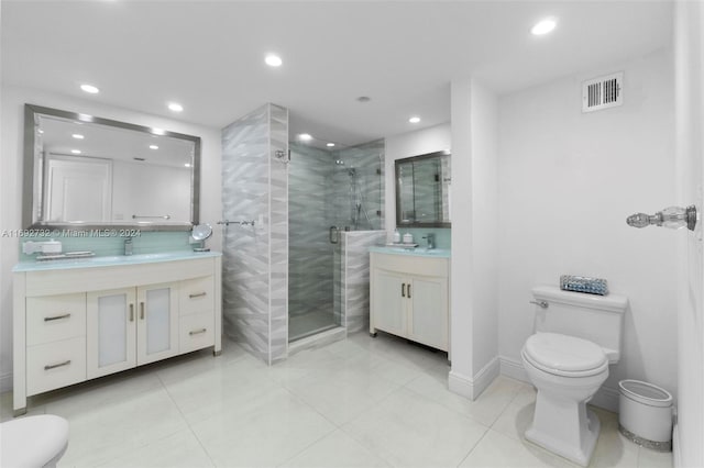 bathroom with walk in shower, tile patterned flooring, vanity, and toilet