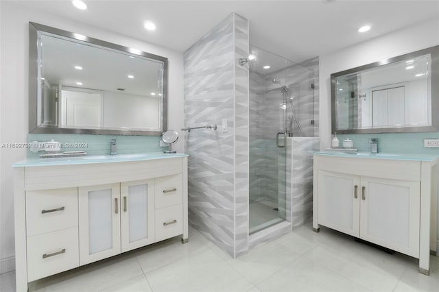 bathroom featuring tile patterned flooring, vanity, and an enclosed shower