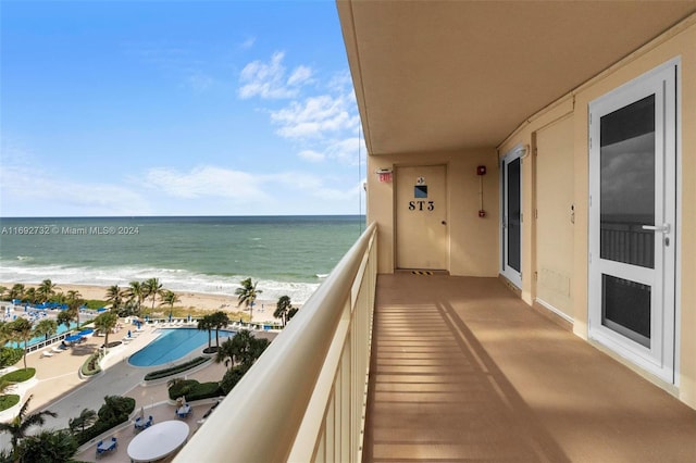 balcony with a view of the beach and a water view