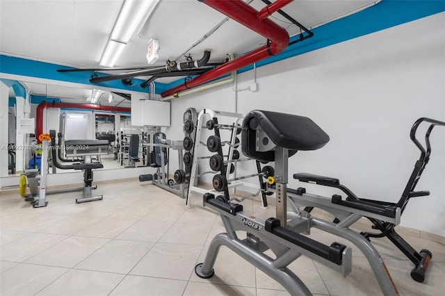 workout area with light tile patterned floors