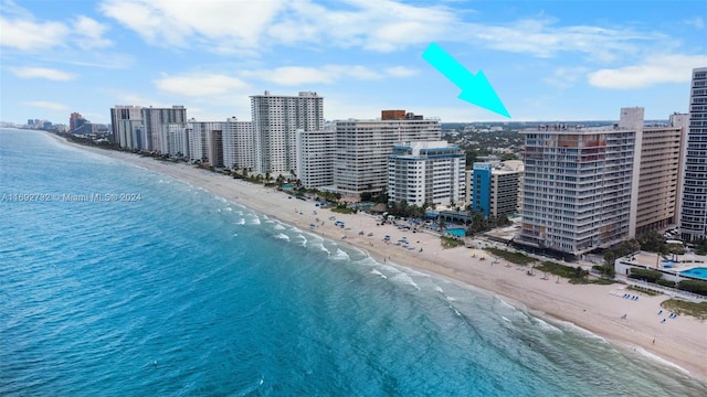 aerial view with a view of the beach and a water view