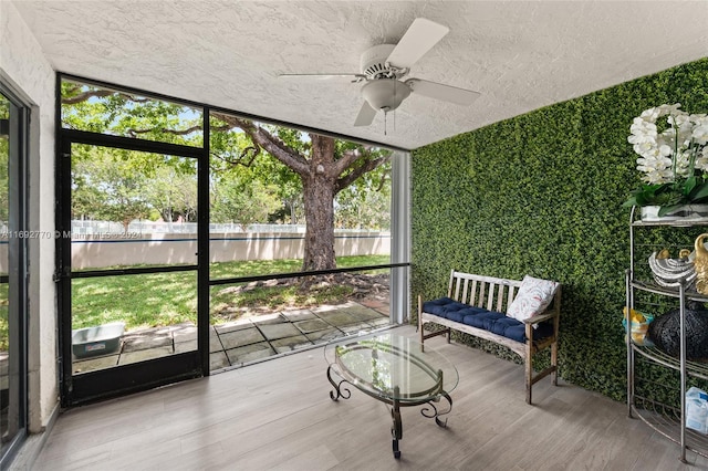 sunroom / solarium with ceiling fan