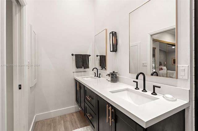 bathroom with vanity and hardwood / wood-style flooring