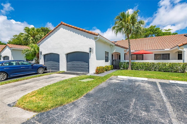 mediterranean / spanish-style home with central AC unit and a garage