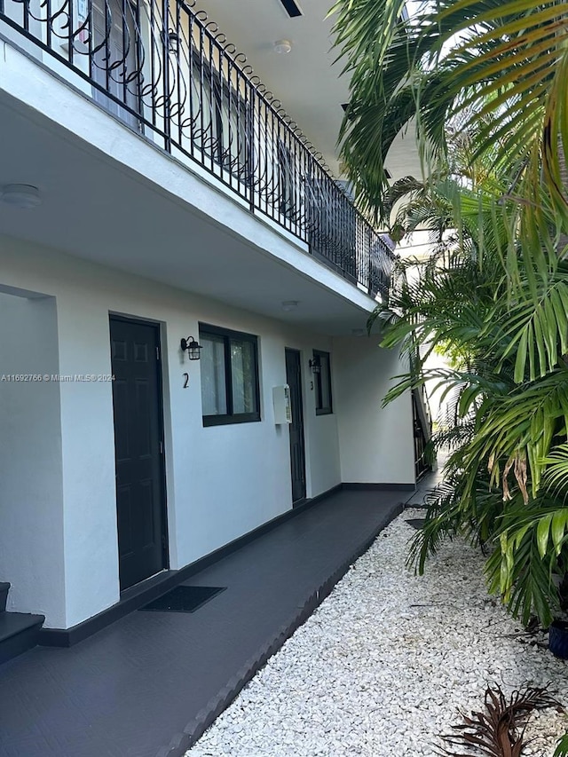 entrance to property with a balcony