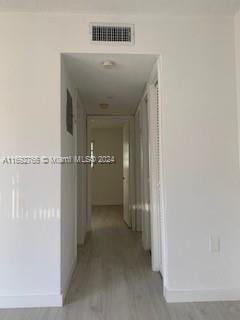 hall featuring light hardwood / wood-style floors