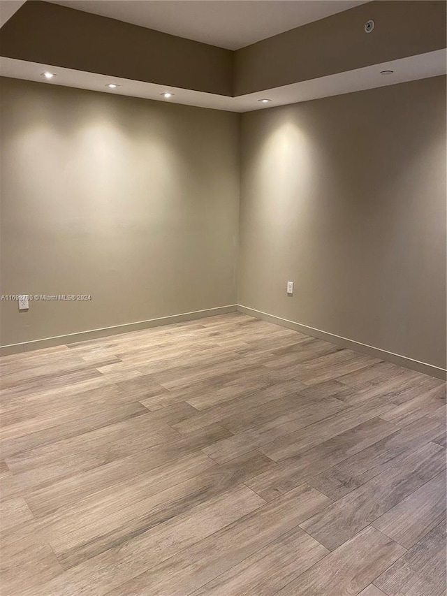 empty room with light hardwood / wood-style floors