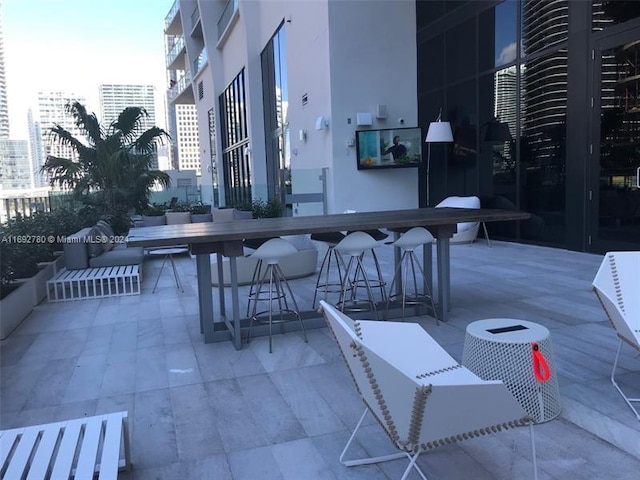 view of patio / terrace featuring an outdoor bar