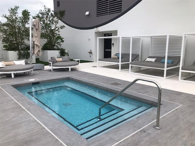 view of swimming pool featuring a patio area