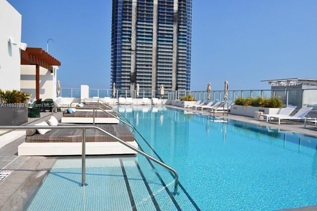 view of swimming pool with a patio area