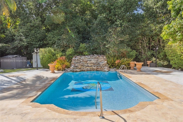 outdoor pool featuring a patio area, a storage shed, and an outdoor structure