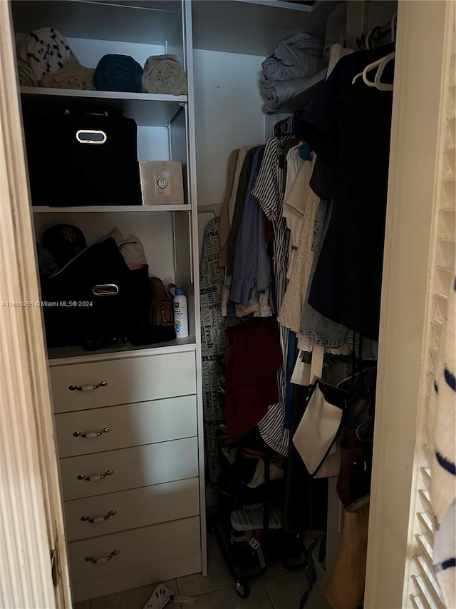 spacious closet featuring tile patterned flooring