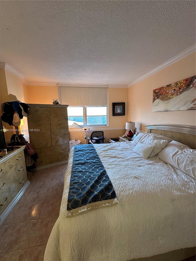 tiled bedroom with crown molding and a textured ceiling