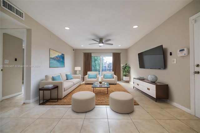 tiled living room featuring ceiling fan