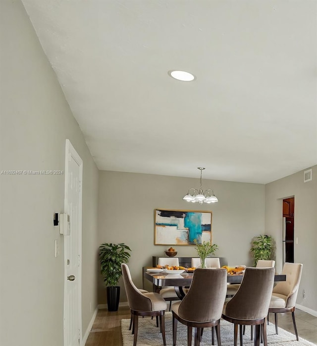 dining space featuring a chandelier