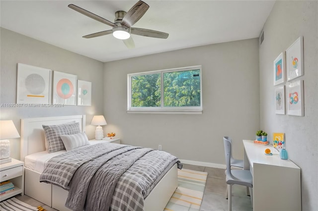 bedroom featuring light tile patterned floors and ceiling fan