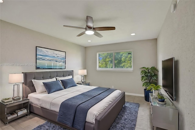 tiled spare room featuring ceiling fan